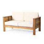 Ensemble causeuse et table basse d'extérieur en bois d'acacia avec coussins